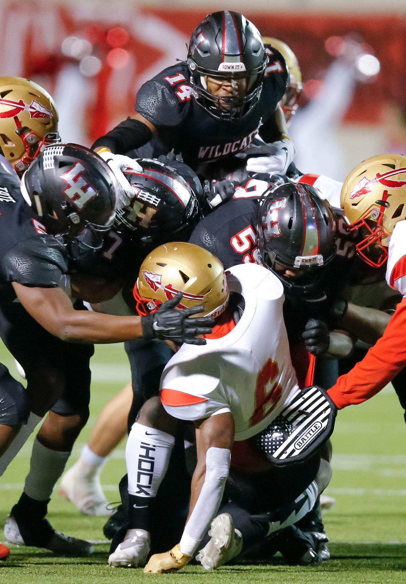 South Grand Prairie junior running back AJ Newberry (6) is tackled by the Lake Highlands...