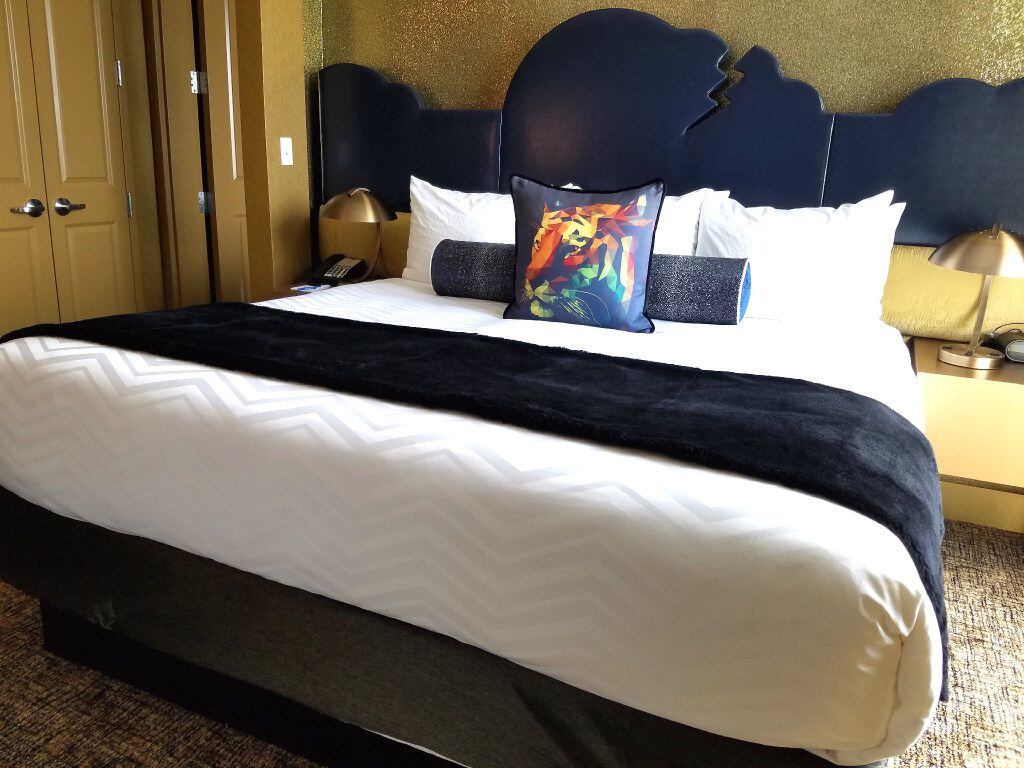 Inside a suite at The Guest House at Graceland in Memphis, a bed features a...