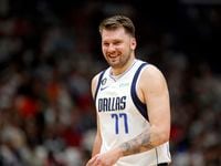 Dallas Mavericks guard Luka Doncic (77) reacts to a call in the first half of an NBA...