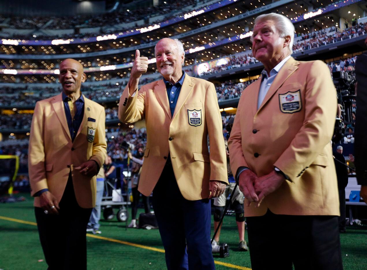 Former Dallas Cowboys and new Pro Football Hall of Fame members (from left) Drew Pearson, Cliff Harris and Jimmy Johnson get ready for the Hall ring presentation by owner Jerry Jones at AT&T Stadium in Arlington, Monday, September 27, 2021. (Tom Fox/The Dallas Morning News)
