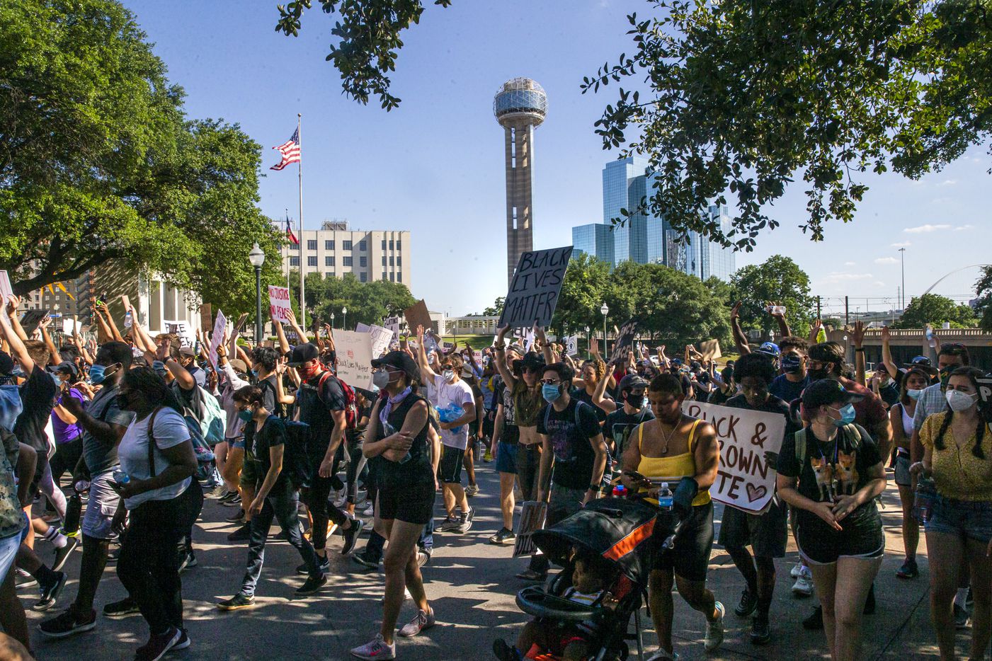 Protesters march from The Grassy Knoll during a demonstration denouncing police brutality...