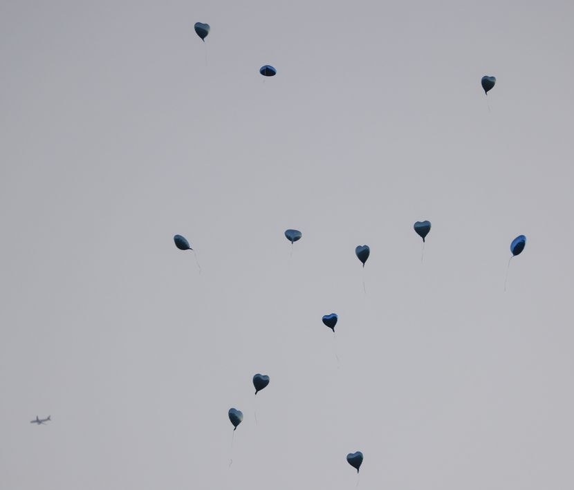 Balloons released after the memorial service of Julio Oliveira on Aug. 29 at White's Chapel...