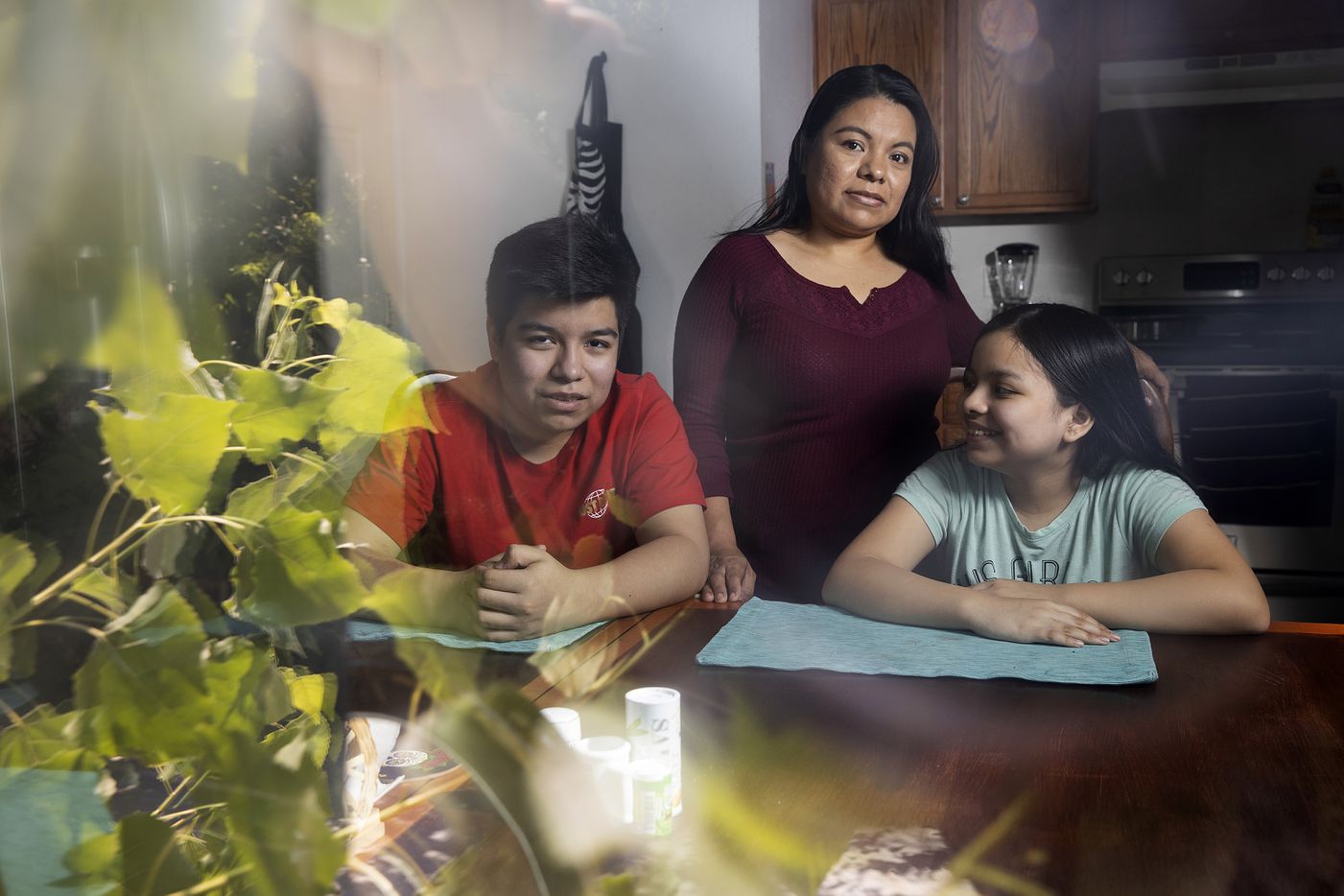 Yolanda Mendoza (center) poses with her two children, Ernesto Nuñez, 12, and Bianca Nuñez,...