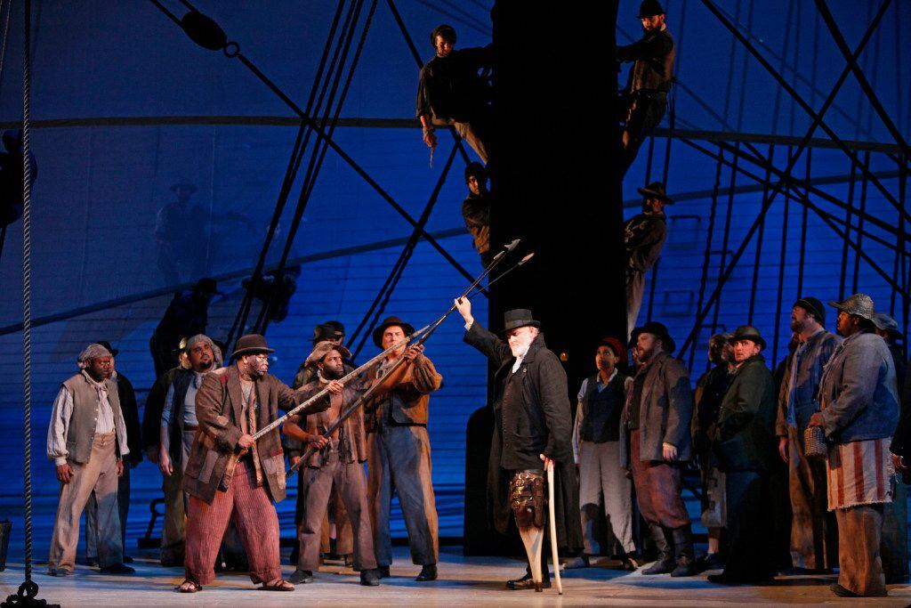At the center of the stage, Captain Ahab (Jay Hunter Morris) tests the harpooners' weapons during a dress rehearsal of "Moby-Dick"  at the Winspear Opera House. (Ben Torres/Special Contributor)