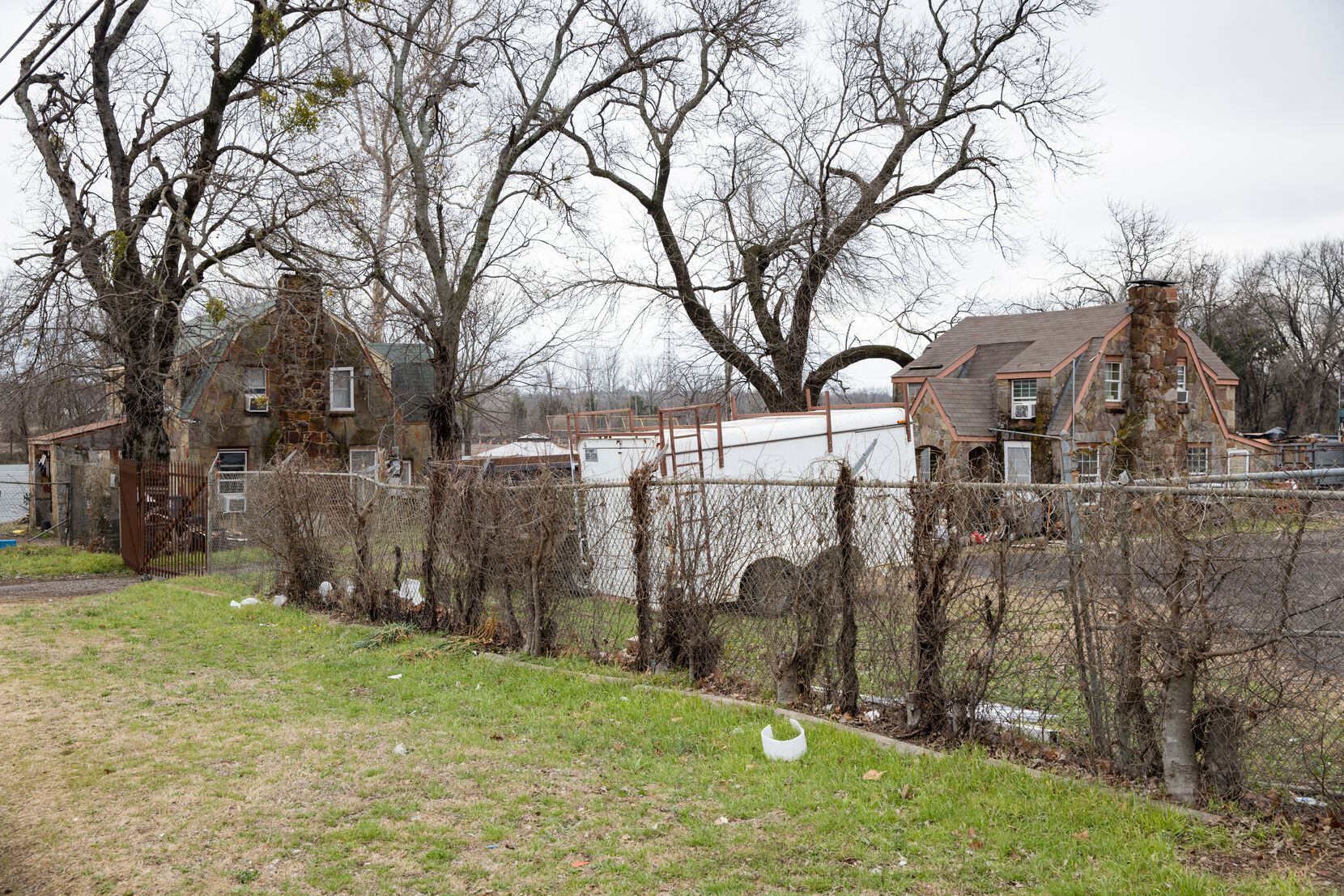 The empty background where Shingle Mountain once towered these two homes photographed in...