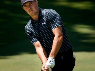 PGA Tour golfer Jordan Spieth chips onto the No. 7 green during the second round of the...