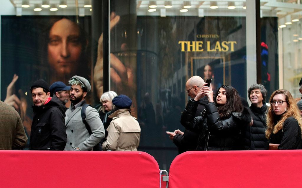 Visitors to Christie's wait outside in a line to view Leonardo da Vinci's "Salvator Mundi",...