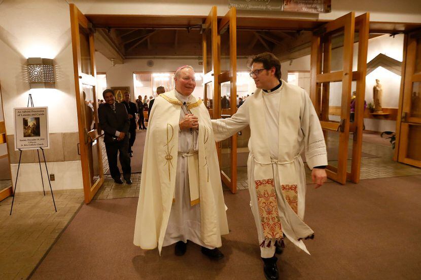 Bishop Edward Burns (left), the new bishop of Dallas, and Rev. Joshua Whitfield walk out of...