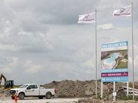 A sign shows the centerpiece lagoon of AnaCapri, a community planned to bring more than...