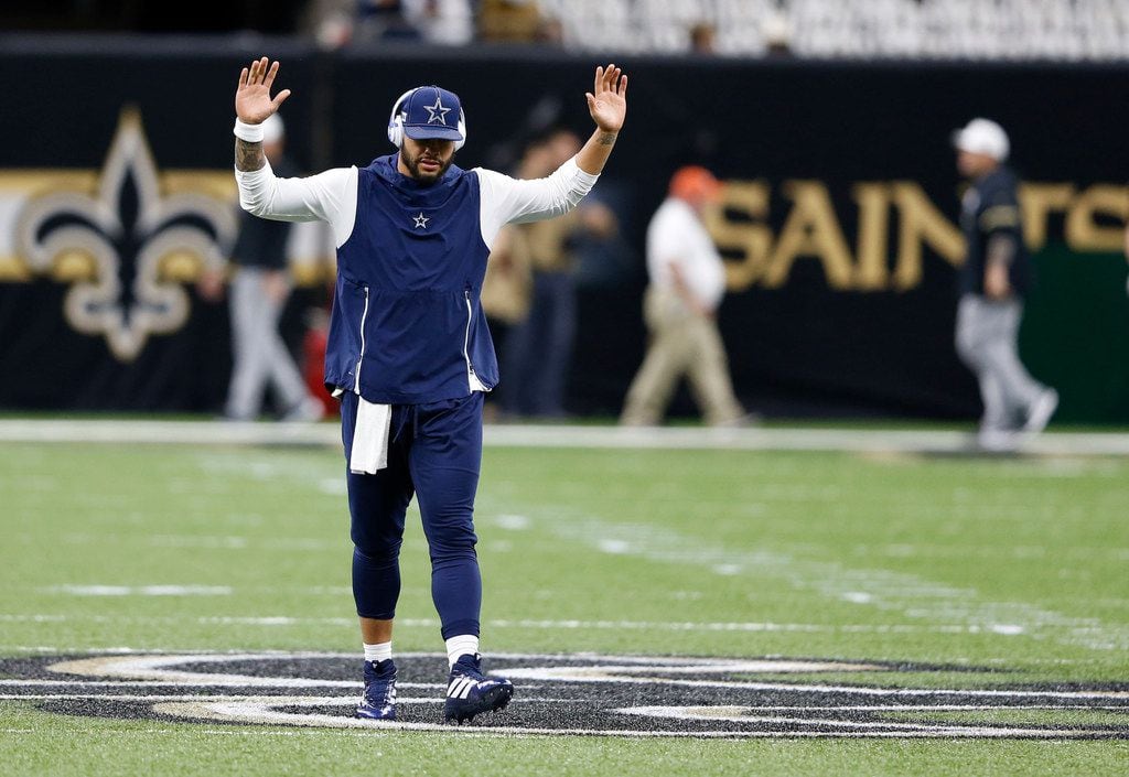 Dallas Cowboys quarterback Dak Prescott (4) goes through his pregame routine before a game against the New Orleans Saints at the Superdome in New Orleans, Louisiana on Sunday, September 29, 2019.