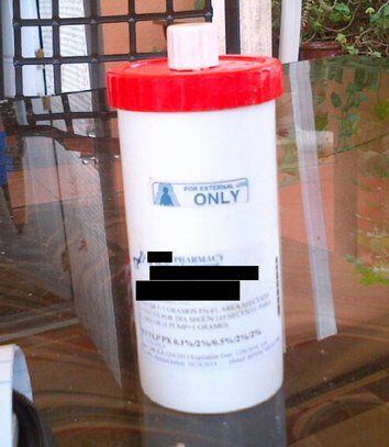 A compounded pain cream container involved in a federal health care fraud case. 
