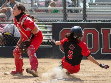 Colleyville Heritage second baseman Leah Perales (5) safely steals home to win the game behind Mansfield Legacy catcher Elisabeth Gaudio (8) during a softball Class 5A area-round playoff game in Colleyville, Texas on Saturday, May 8, 2021. (Elias Valverde II / Special Contributor)