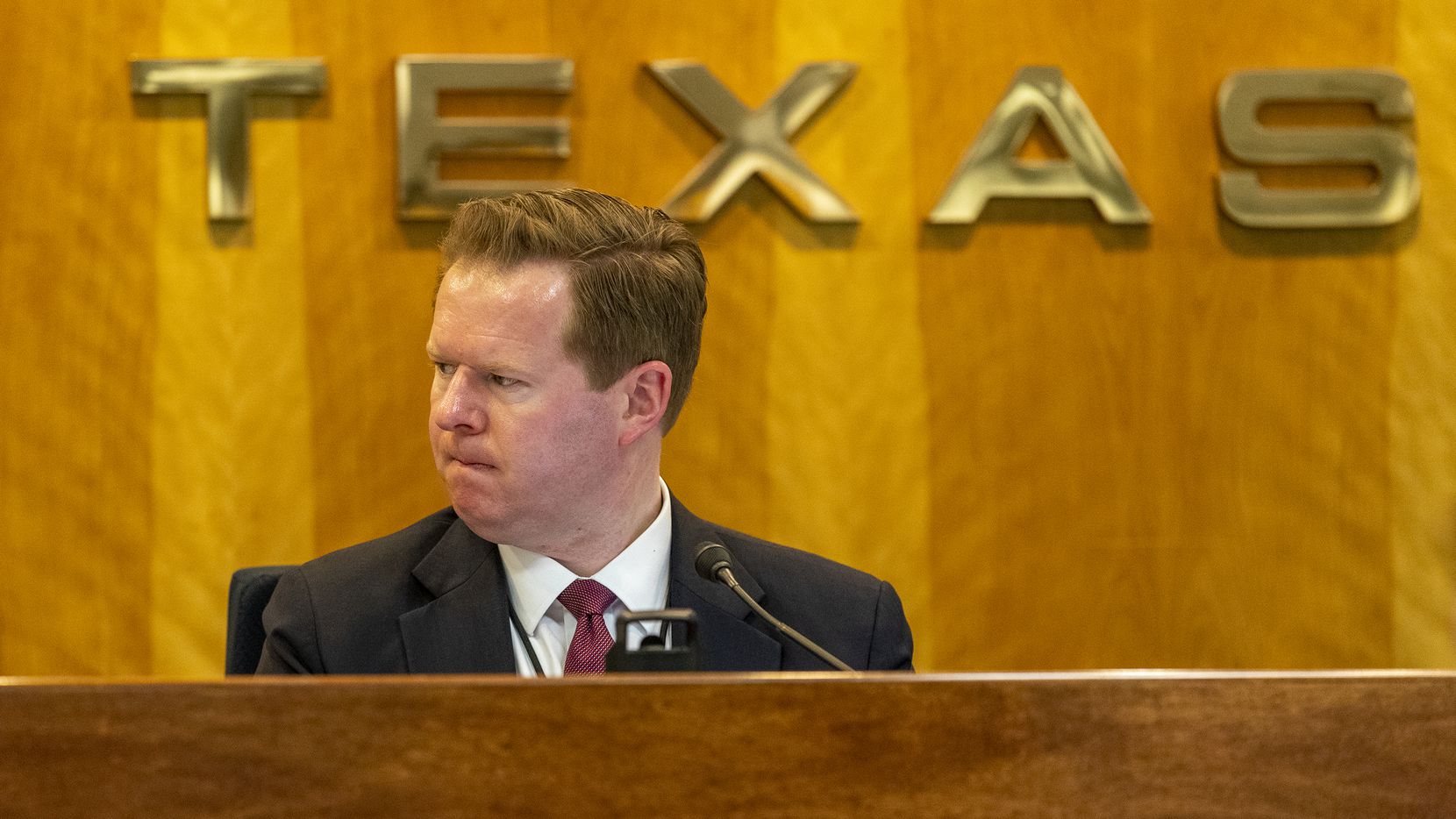 Public Utility Commission of Texas chairman Peter Lake listens to testimony during a...