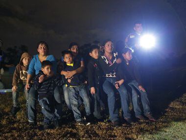 FILE - This June 25, 2014 file photo, shows a group of immigrants from Honduras and El...