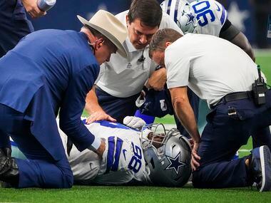Dallas Cowboys defensive tackle Quinton Bohanna receives attention after being injured...
