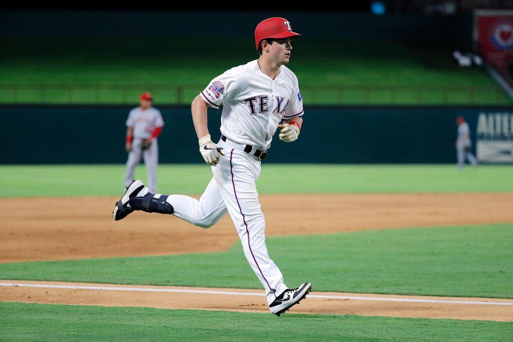 Texas Rangers' Nick Solak runs the bases after hitting solo home run on a pitch from Los...