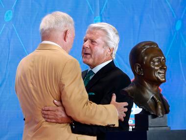 FILE - Former Cowboys head coach Jimmy Johnson talks with 2017 Pro Football Hall of Fame inductee and Cowboys owner Jerry Jones at the Pro Football Hall of Fame enshrinement ceremony at Tom Benson Stadium in Canton, Ohio, on Saturday, Aug. 6, 2017.