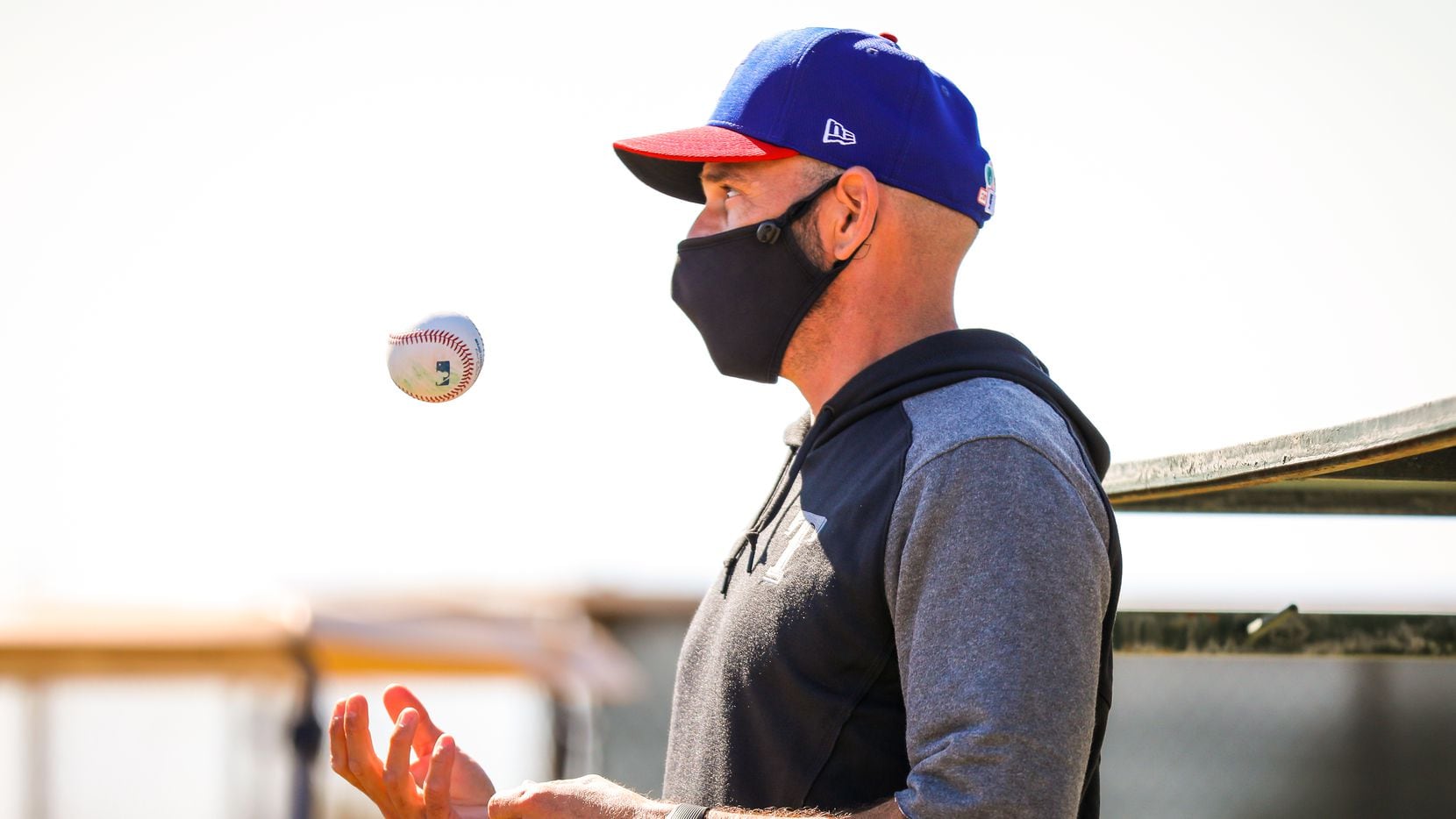 Manager Chris Woodward watches as pitchers and catchers report for the first day of workouts at Spring Training, Weds. Feb. 17, 2021 in Surprise, Ariz.