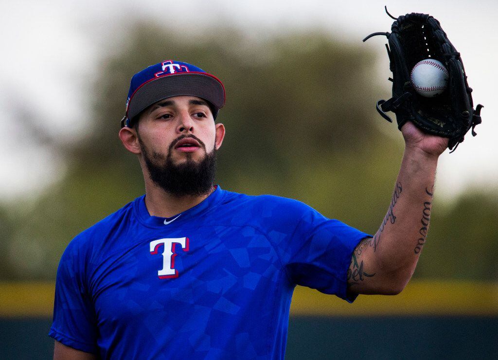 Texas Rangers second baseman Rougned Odor (12) catches a ball during a spring training...