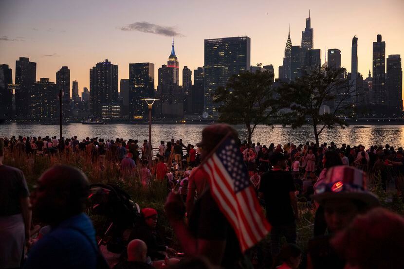 People wait for fireworks in New York, July 4, 2023.