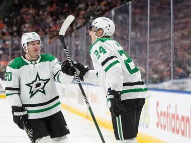 Dallas Stars' Ryan Suter (20) and Roope Hintz (24) celebrate a goal against the Edmonton...