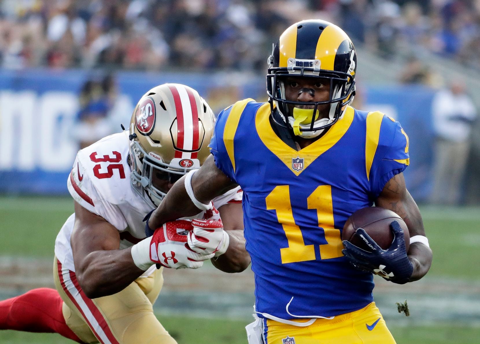 FILE - Tavon Austin (11) runs with the ball during the first half of a game against the San...