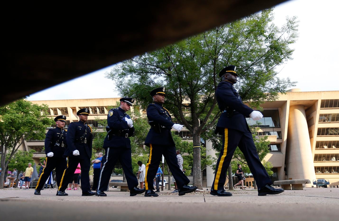 A member of the DART (Dallas Area Rapid Transit) Police Honor Guard (third from left)...