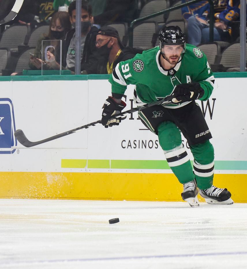 Dallas Stars center Tyler Seguin (91) chases after the puck during the first period of a Dallas Stars preseason game against St. Louis Blues on Tuesday, Oct. 5, 2021, at American Airlines Center in Dallas. (Juan Figueroa/The Dallas Morning News)