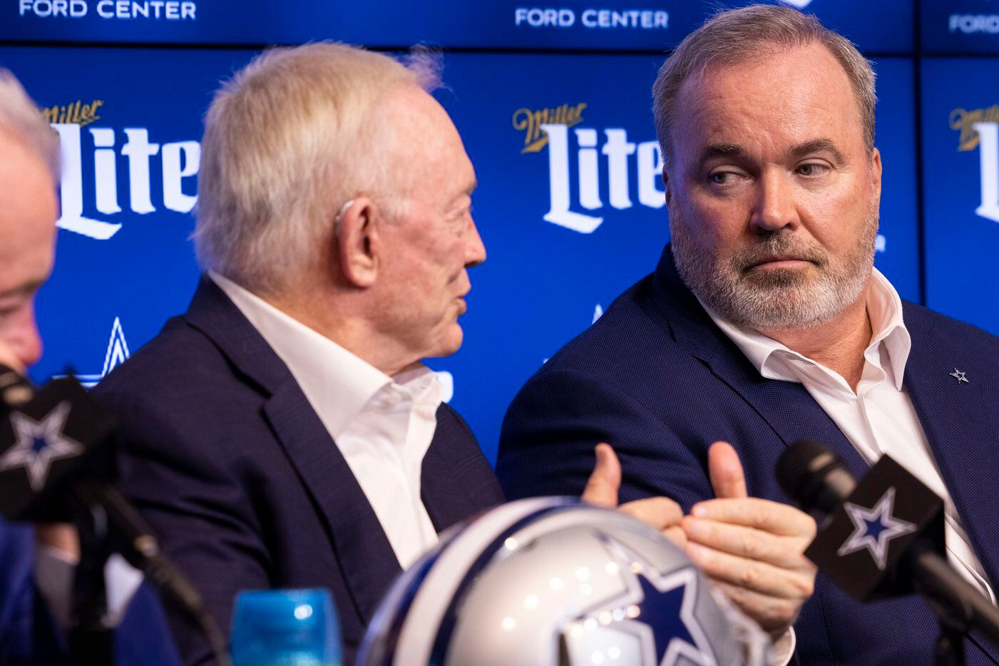 Dallas Cowboys head coach Mike McCarthy listens to owner Jerry Jones speak at a press...