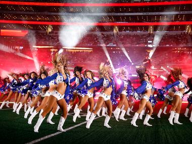 The Dallas Cowboys Cheerleaders dance during country music artist Luke Combs halftime...