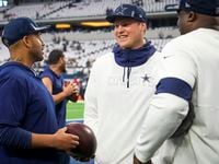 Dallas Cowboys defensive tackle Brent Urban talks with defensive line coach Aden Durde...
