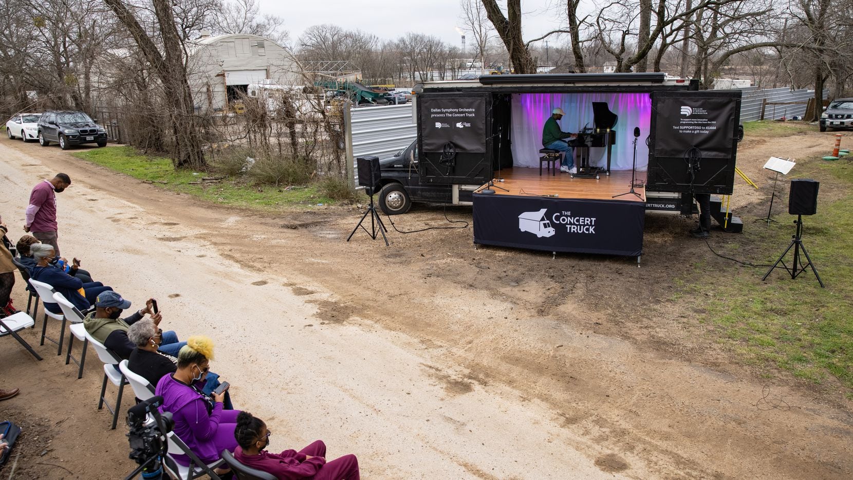Shaun Martin performs outside of Marsha Jackson's home in Dallas on Friday, Feb. 26, 2021....