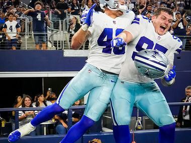 Dallas Cowboys tight end Peyton Hendershot (49) celebrates with defensive tackle John...