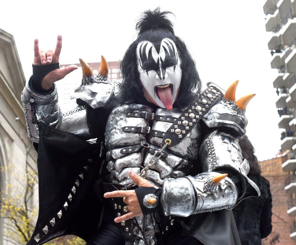 Gene Simmons of Kiss sticks his tongue out as the band comes down Central Park West during...