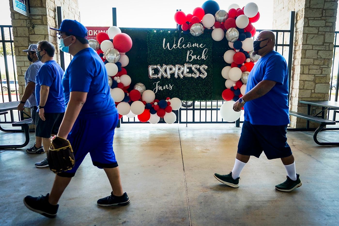 Signs and balloons welcome fans on the concourse after the gates opened at Dell Diamond for...