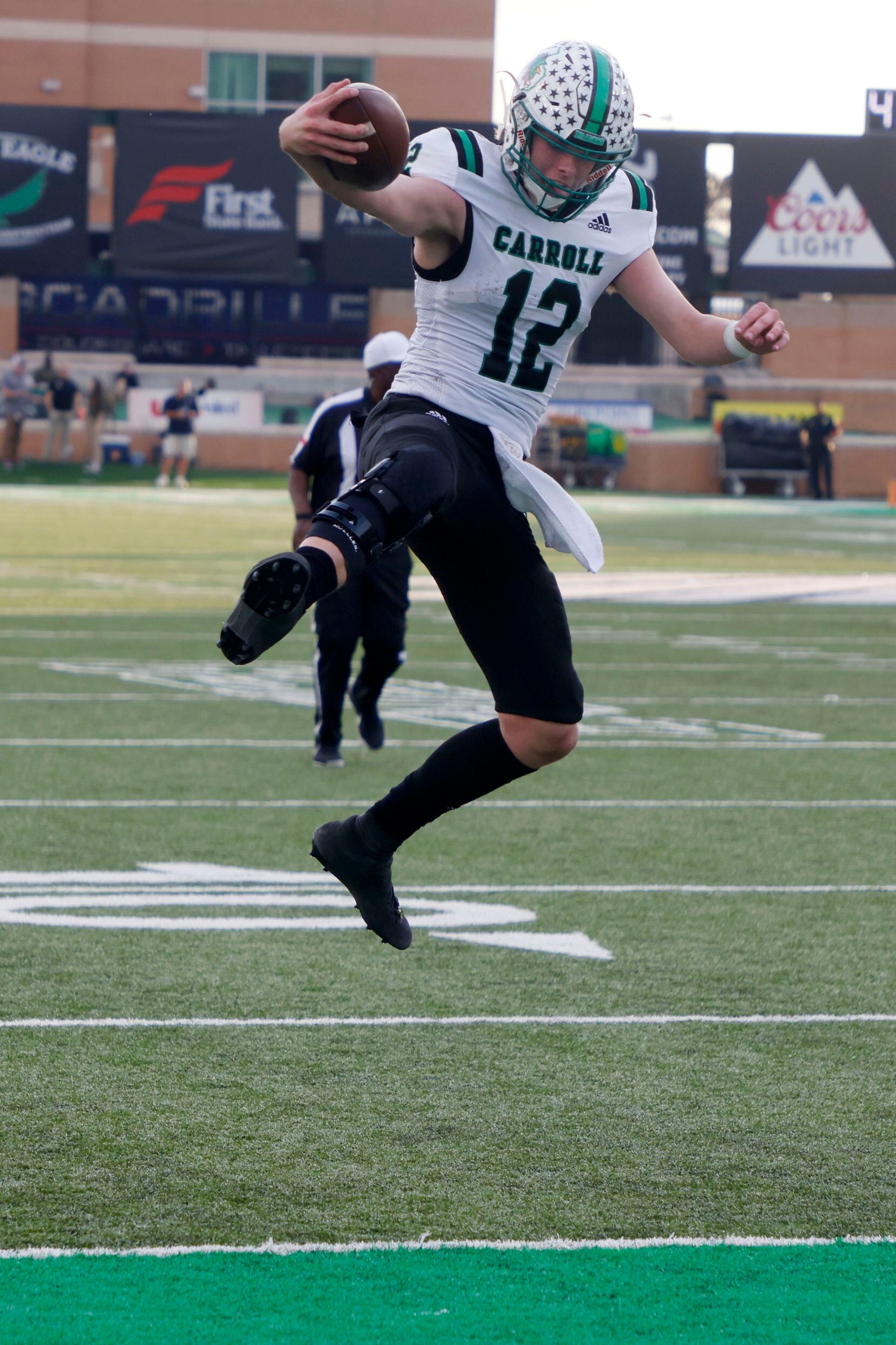 Southlake Carroll quarterback Kaden Anderson (12) leaps into the end zone for a touchdown against Allen during the second half of a Class 6A Division I Region I final high school football game in Denton, Texas on Saturday, Dec. 4, 2021. Southlake defeated Allen 47-21. (Michael Ainsworth/Special Contributor)