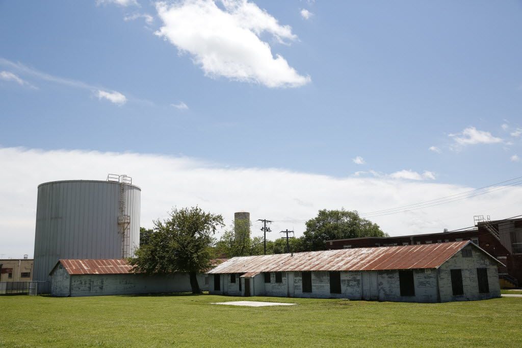 An unused building (left) sits next to the building and silo used for chilling water at the...