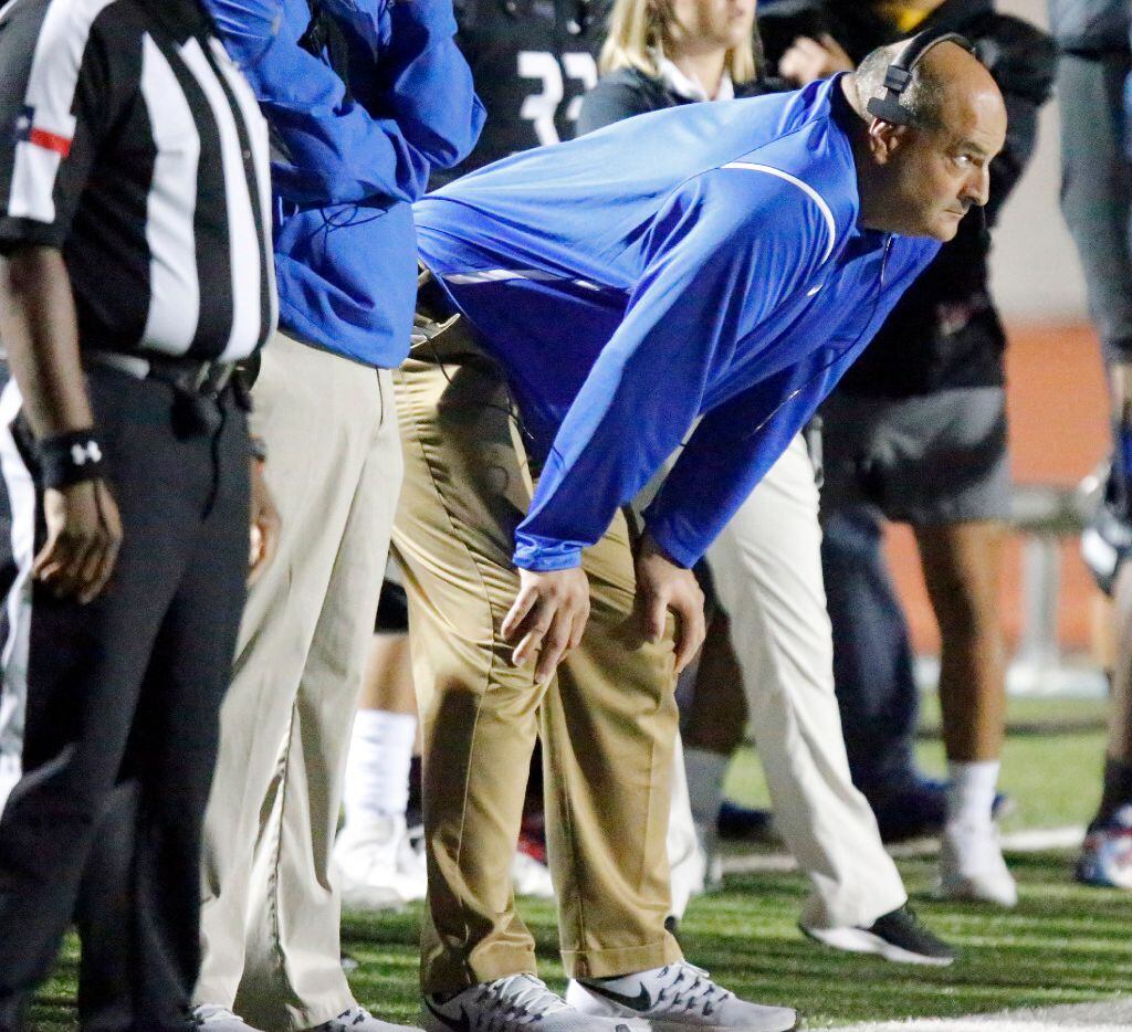 Hebron High School head coach Brian Brazil watches the action during the first half as...