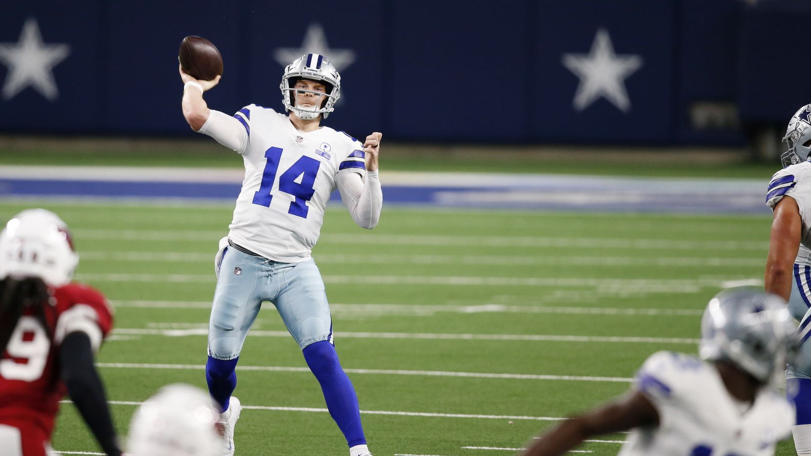 Dallas Cowboys quarterback Andy Dalton (14) attempts a pass in a game against the Arizona...