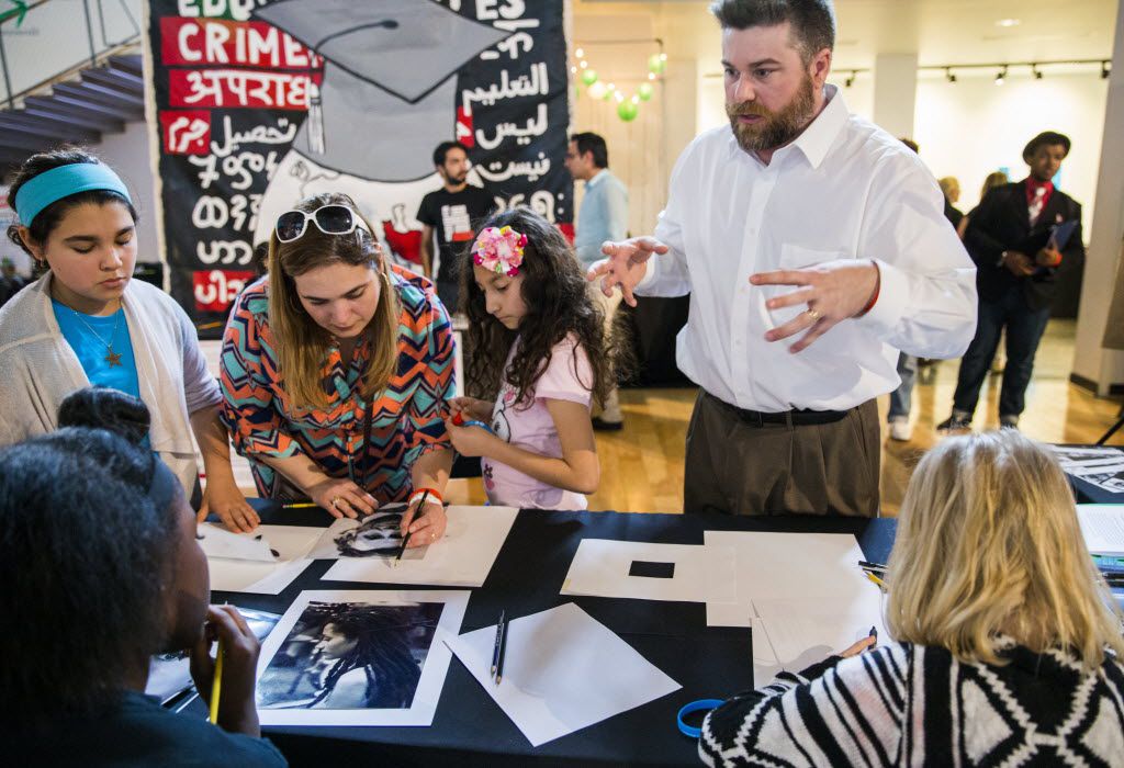 Artist Jason Kinney, right, teaches drawing lessons in the Women's Museum during The Dallas...