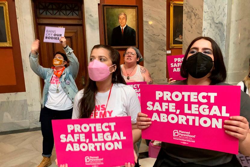FILE - Abortion-rights supporters chant their objections at the Kentucky Capitol, April 13,...