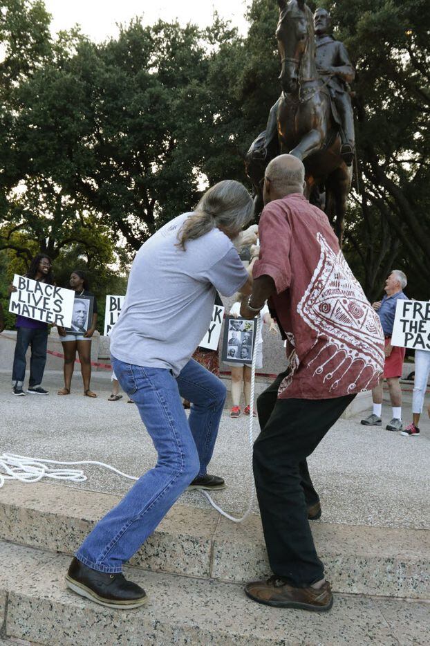 John Fullinwider and Charles Hillman tried to symbolically topple the statue of Robert E....