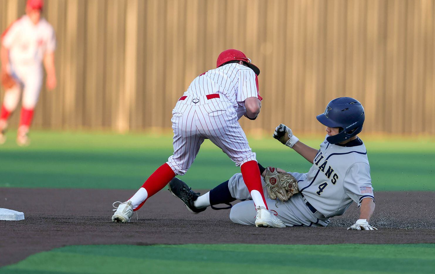 Keller outfielder Zach Makarawich (4) gets tagged out at second base by Flower Mound Marcus...