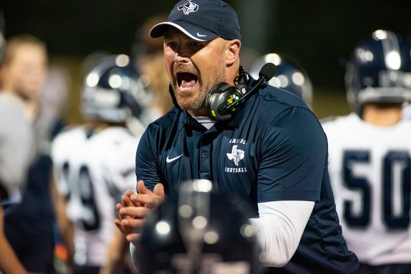 Argyle Liberty Christian Head Coach Jason Witten encourage his players after scoring a...