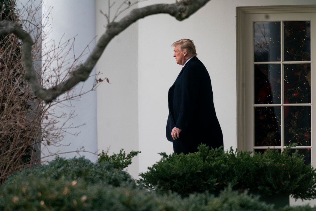 President Donald Trump leaves the Oval Office at the White House in Washington, and prepares...