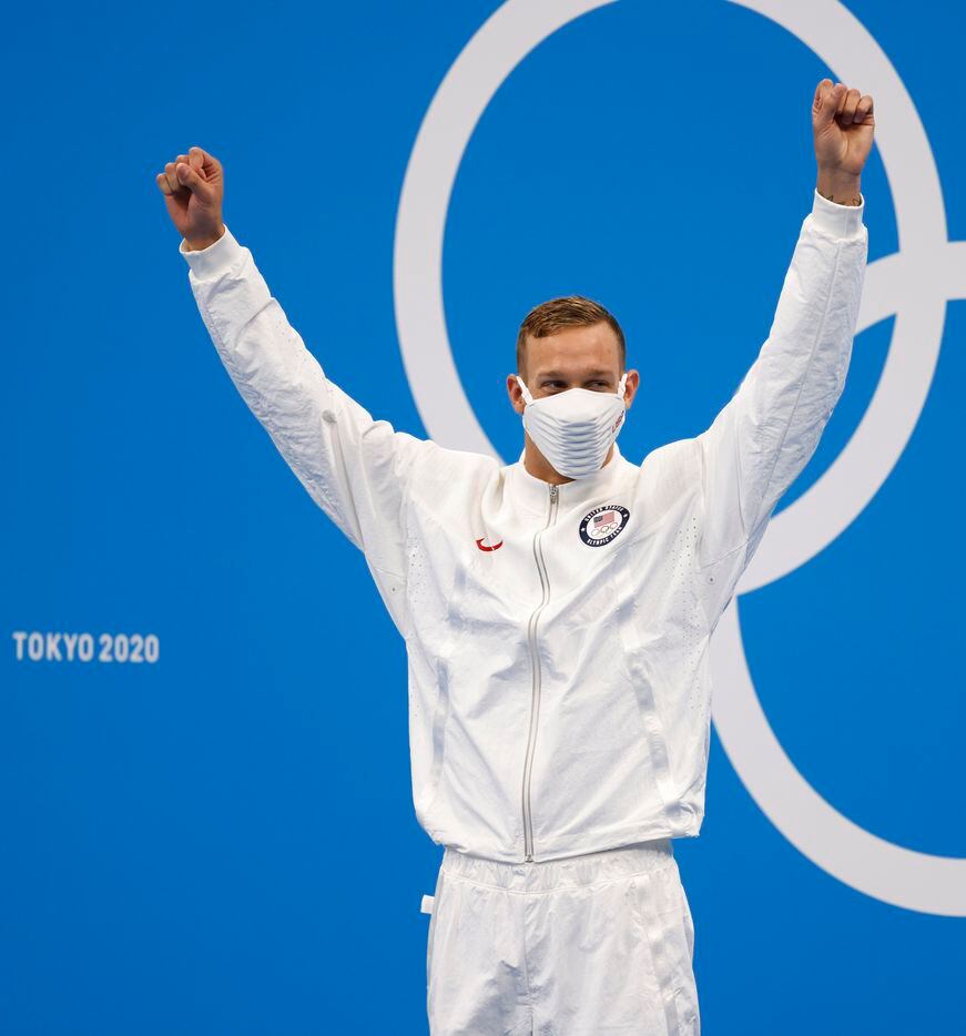 USA’s Caeleb Dressel celebrates as he is introduced during the medal ceremony for the men’s...