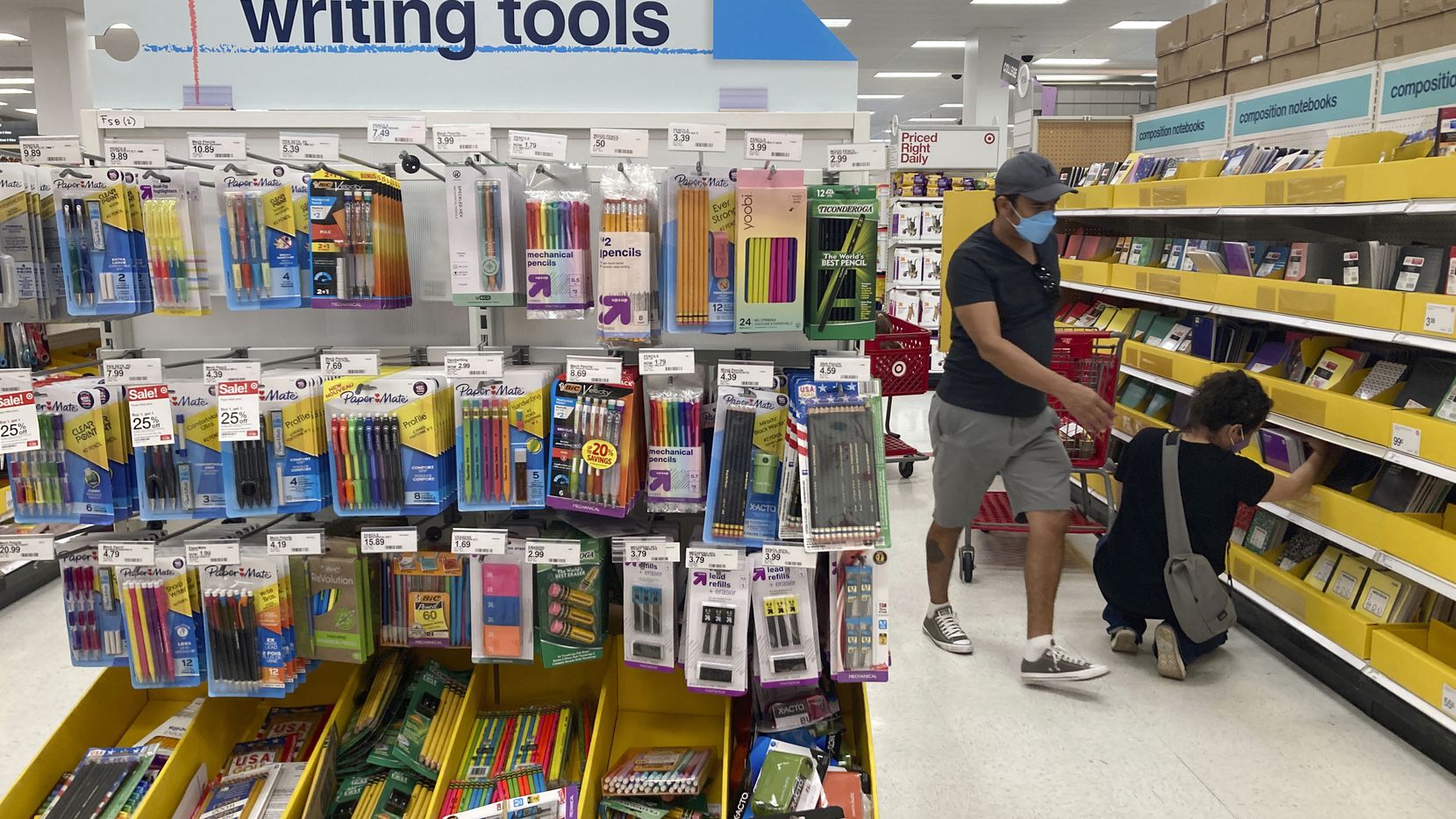 Shoppers look for school supplies deals at a Target store during back-to-school shopping...