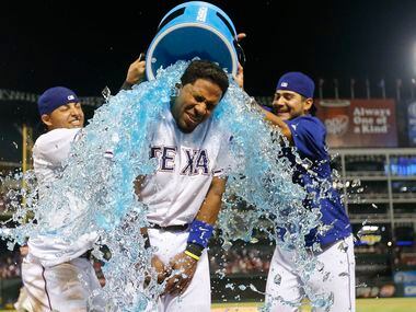 Texas Rangers shortstop Elvis Andrus (1) gets an ice-bath from Texas Rangers second baseman...