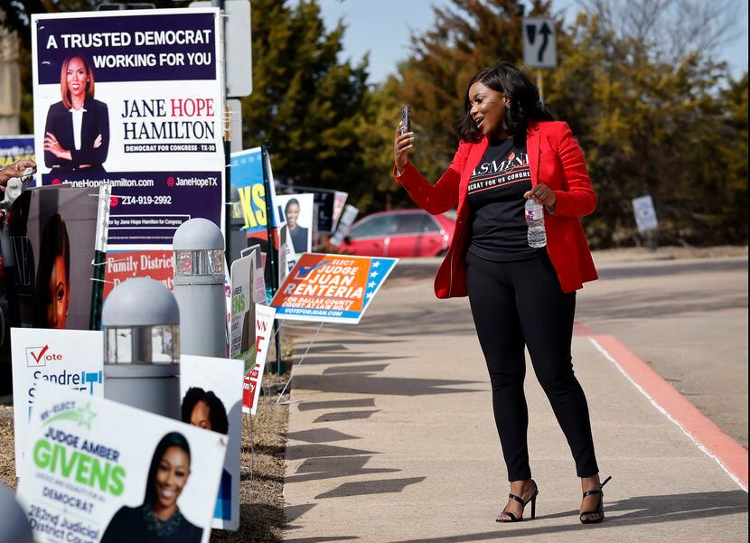 U.S. House Texas District 30 candidate Jasmine Crockett records a video of herself as she...