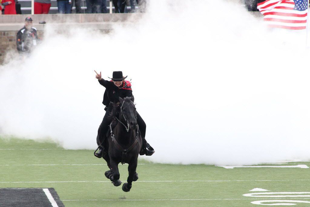 Nov 14, 2015; Lubbock, TX, USA; The Texas Tech Red Raiders Masked Rider enters the field...